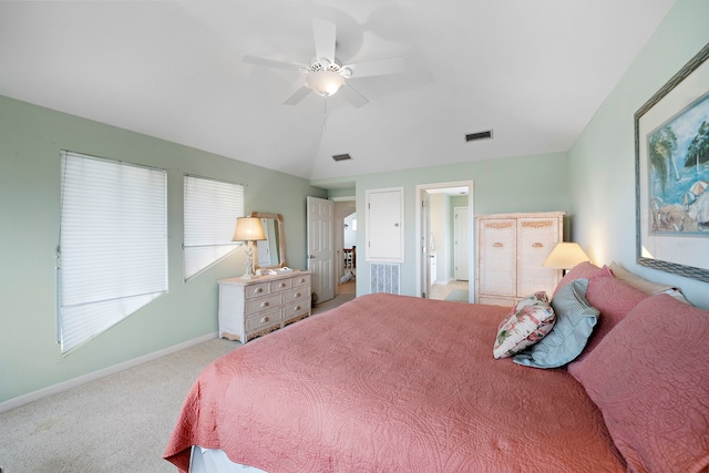 carpeted bedroom featuring ceiling fan and vaulted ceiling