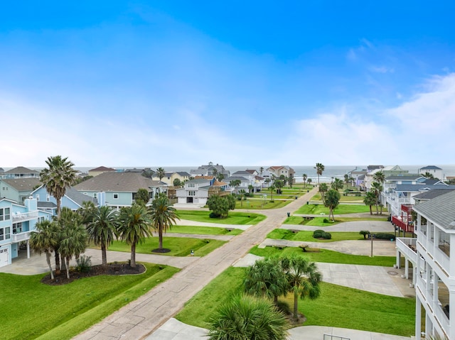 surrounding community featuring a water view and a yard