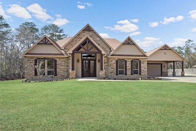 view of front of home featuring a garage, a front yard, french doors, and a carport