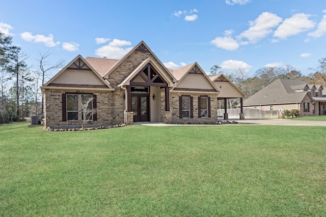 view of front of home with central AC, a front lawn, and french doors