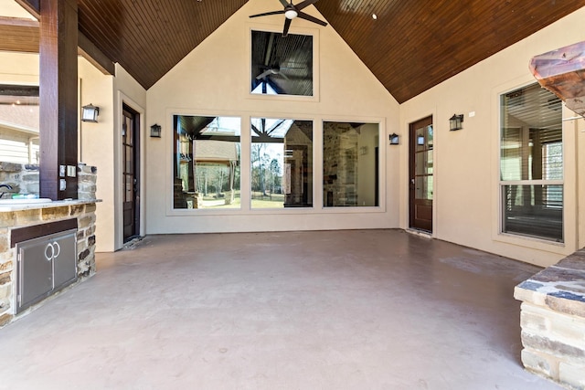 view of patio featuring ceiling fan and exterior kitchen