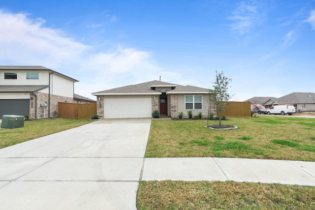 view of front of home with a garage and a front yard