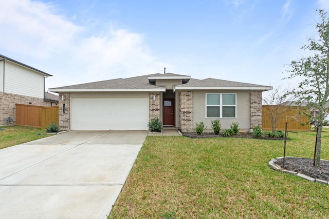 view of front of property featuring a garage and a front yard