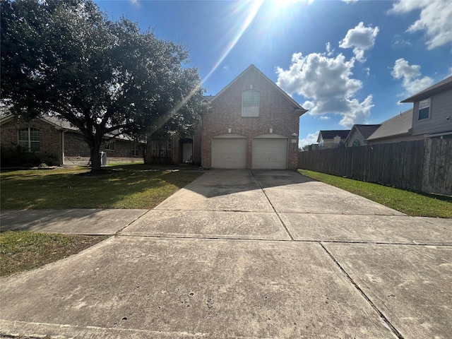 view of front of house featuring a garage and a front yard