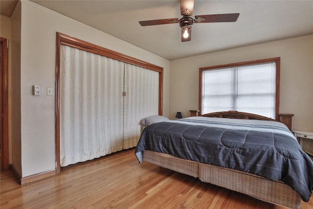 bedroom featuring ceiling fan and light wood-type flooring