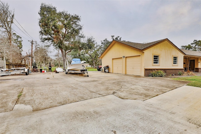 view of side of home featuring a garage