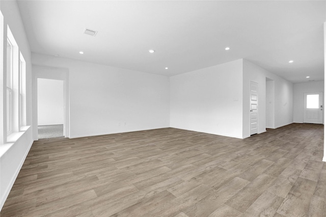 unfurnished living room with light hardwood / wood-style flooring