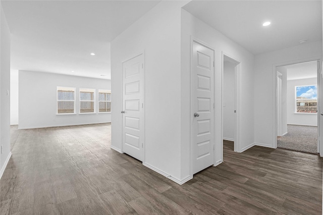 hall with dark hardwood / wood-style flooring