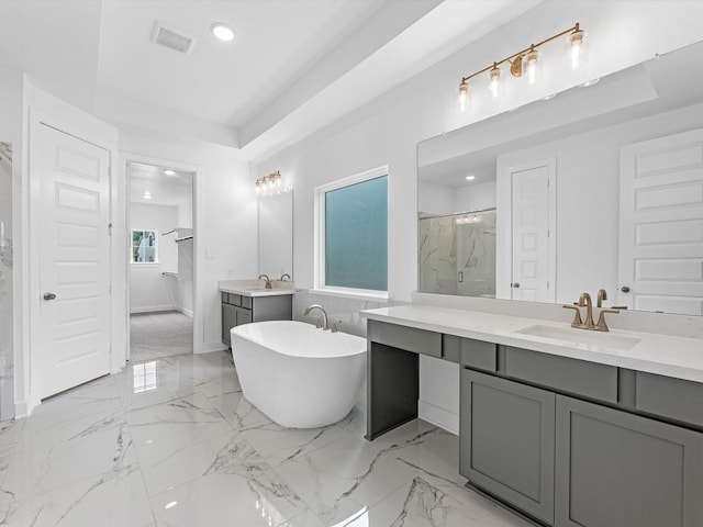 8318 Aussie Beadhead Dr, Fulshear, TX 77441 - full bathroom featuring two vanities, a marble finish shower, a freestanding tub, recessed lighting, and marble finish floors
