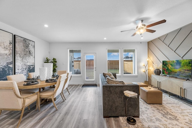 living room featuring hardwood / wood-style flooring and ceiling fan