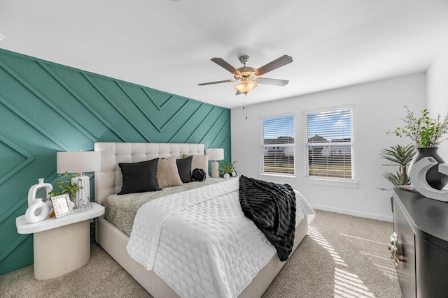 bedroom with ceiling fan and carpet