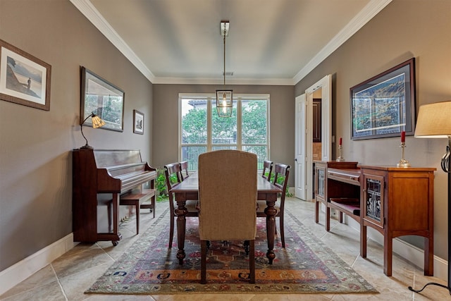 dining space with baseboards and ornamental molding