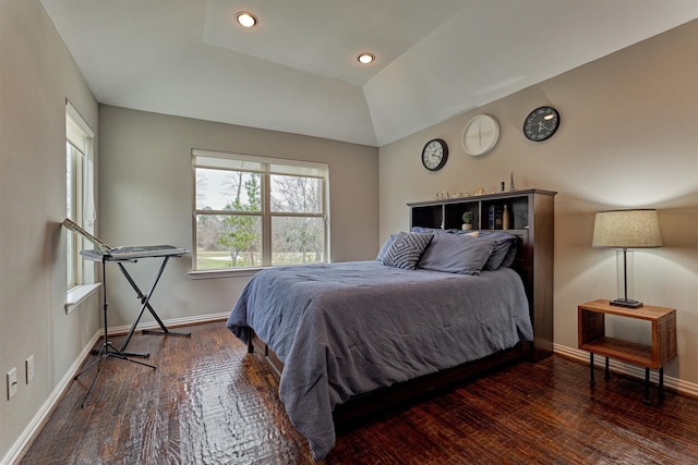 bedroom featuring lofted ceiling, baseboards, dark wood finished floors, and recessed lighting