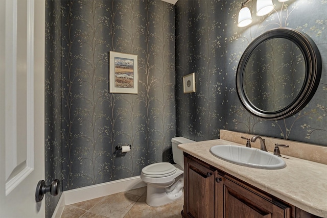 bathroom with tile patterned flooring, vanity, toilet, and wallpapered walls