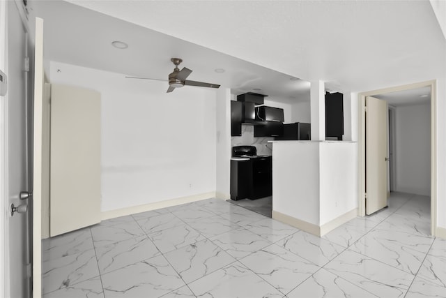 kitchen featuring black refrigerator and ceiling fan