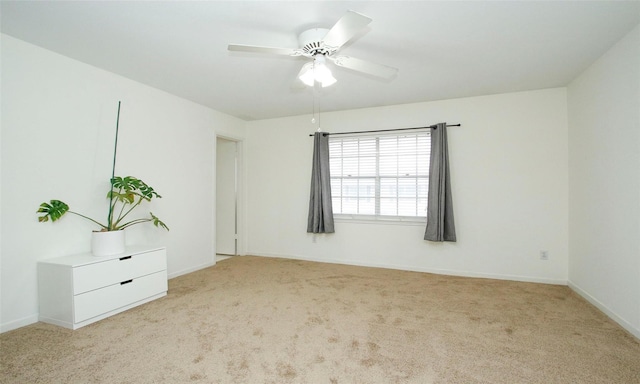 empty room with light carpet and ceiling fan