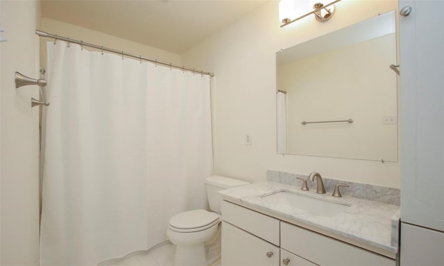 bathroom featuring vanity, toilet, and tile patterned flooring