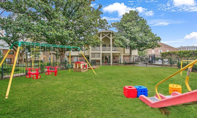 view of jungle gym featuring a lawn