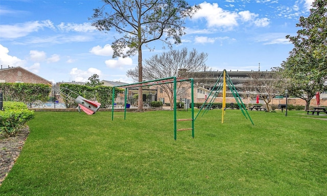 view of play area featuring a lawn