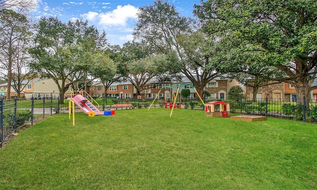 view of jungle gym with a lawn