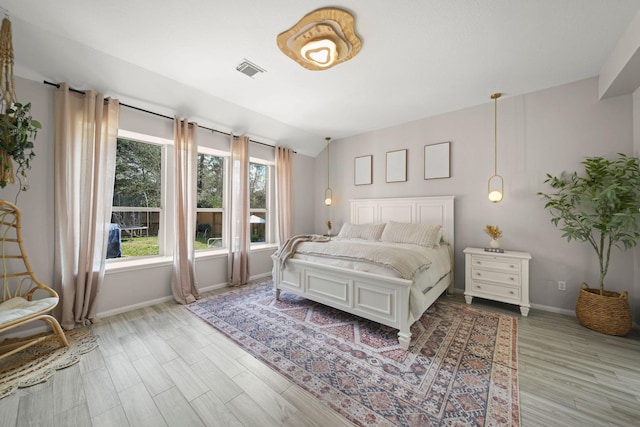 bedroom with light wood-type flooring