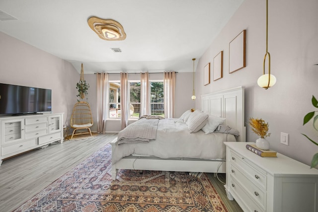 bedroom with hardwood / wood-style flooring