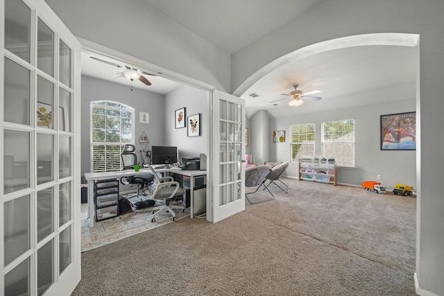 carpeted office space with plenty of natural light, french doors, and ceiling fan