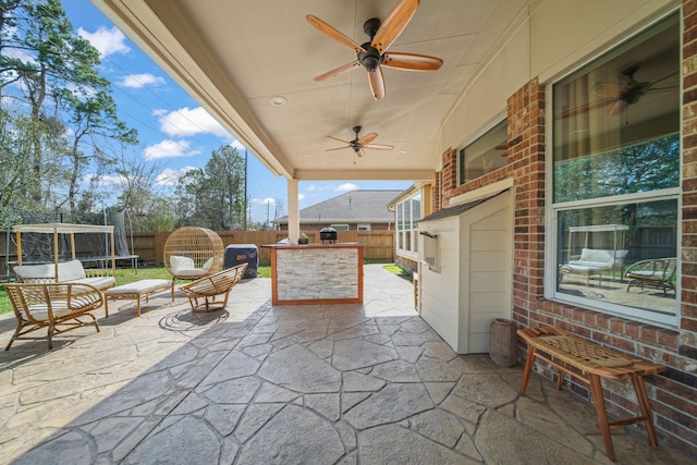 view of patio / terrace featuring a trampoline and ceiling fan