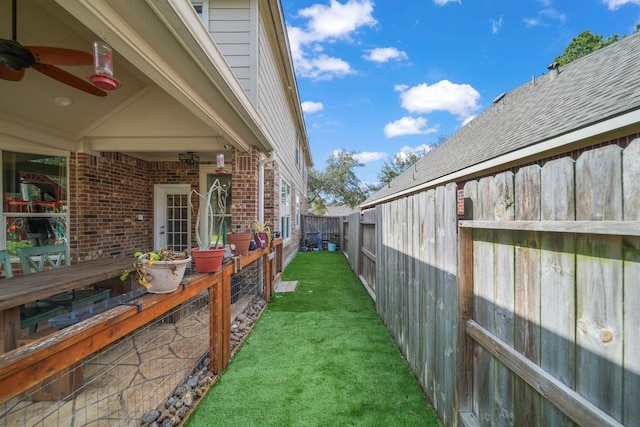 view of yard featuring ceiling fan