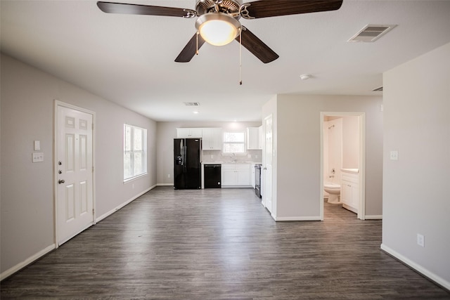 unfurnished living room with dark hardwood / wood-style floors