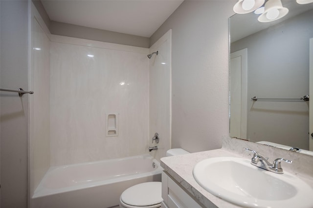 full bathroom featuring bathtub / shower combination, vanity, and toilet