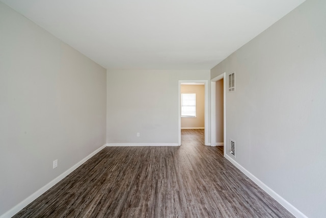 empty room featuring dark hardwood / wood-style floors