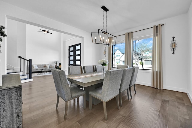 dining room featuring wood-type flooring and a chandelier