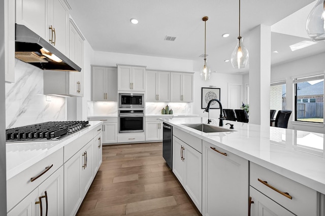 kitchen featuring white cabinetry, appliances with stainless steel finishes, and sink