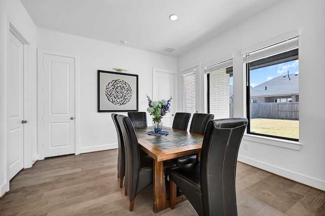 dining area with wood-type flooring