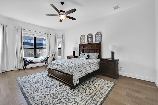 bedroom with ceiling fan and light hardwood / wood-style floors