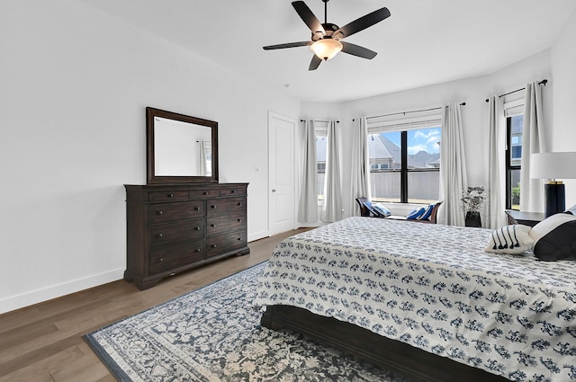 bedroom with hardwood / wood-style flooring and ceiling fan