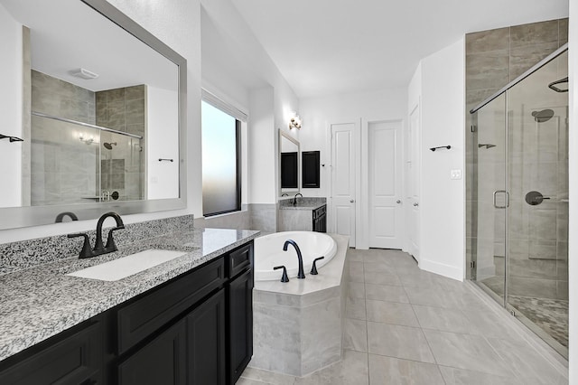 bathroom featuring vanity, tile patterned flooring, and independent shower and bath