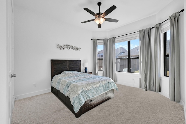 bedroom with light colored carpet and ceiling fan