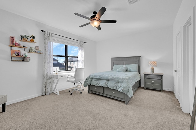 carpeted bedroom with ceiling fan