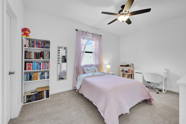 bedroom featuring ceiling fan and light colored carpet