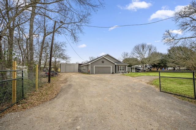 ranch-style house with a garage and a front lawn