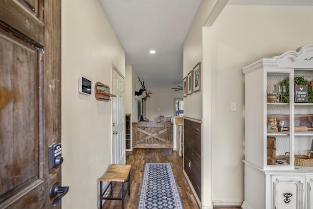 hall with dark hardwood / wood-style floors