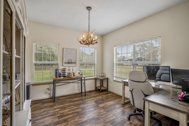 office featuring an inviting chandelier, a textured ceiling, and dark hardwood / wood-style flooring