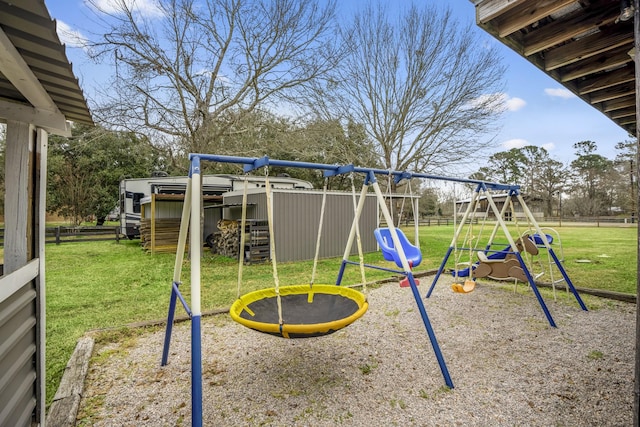 view of playground with a yard and a trampoline