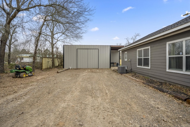 view of yard with cooling unit and an outdoor structure