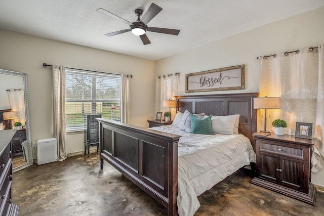 bedroom featuring ceiling fan and a textured ceiling