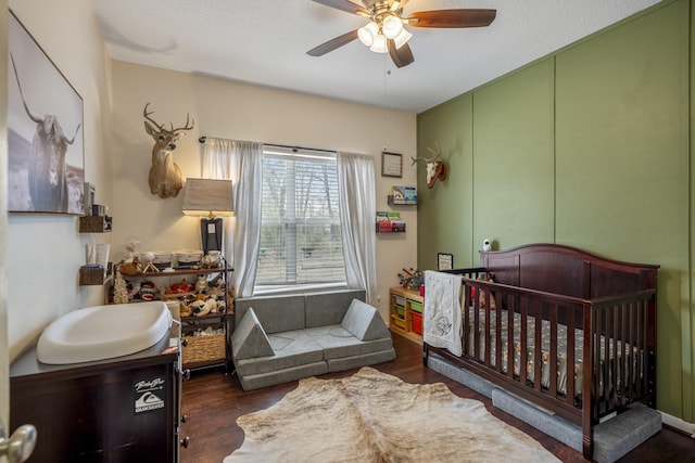 bedroom featuring ceiling fan and dark hardwood / wood-style floors