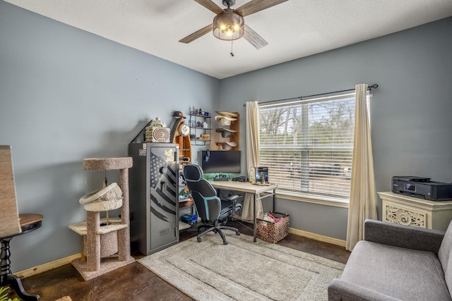 home office featuring a textured ceiling and ceiling fan