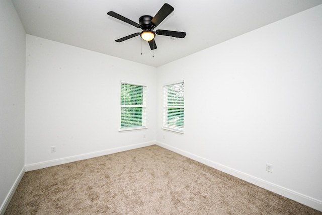 1415 E 35th St, Houston, TX 77022 - carpeted empty room with baseboards and ceiling fan